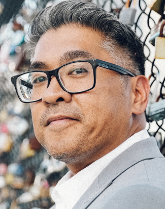 Shane Santiago — President, Chief Experience Officer
